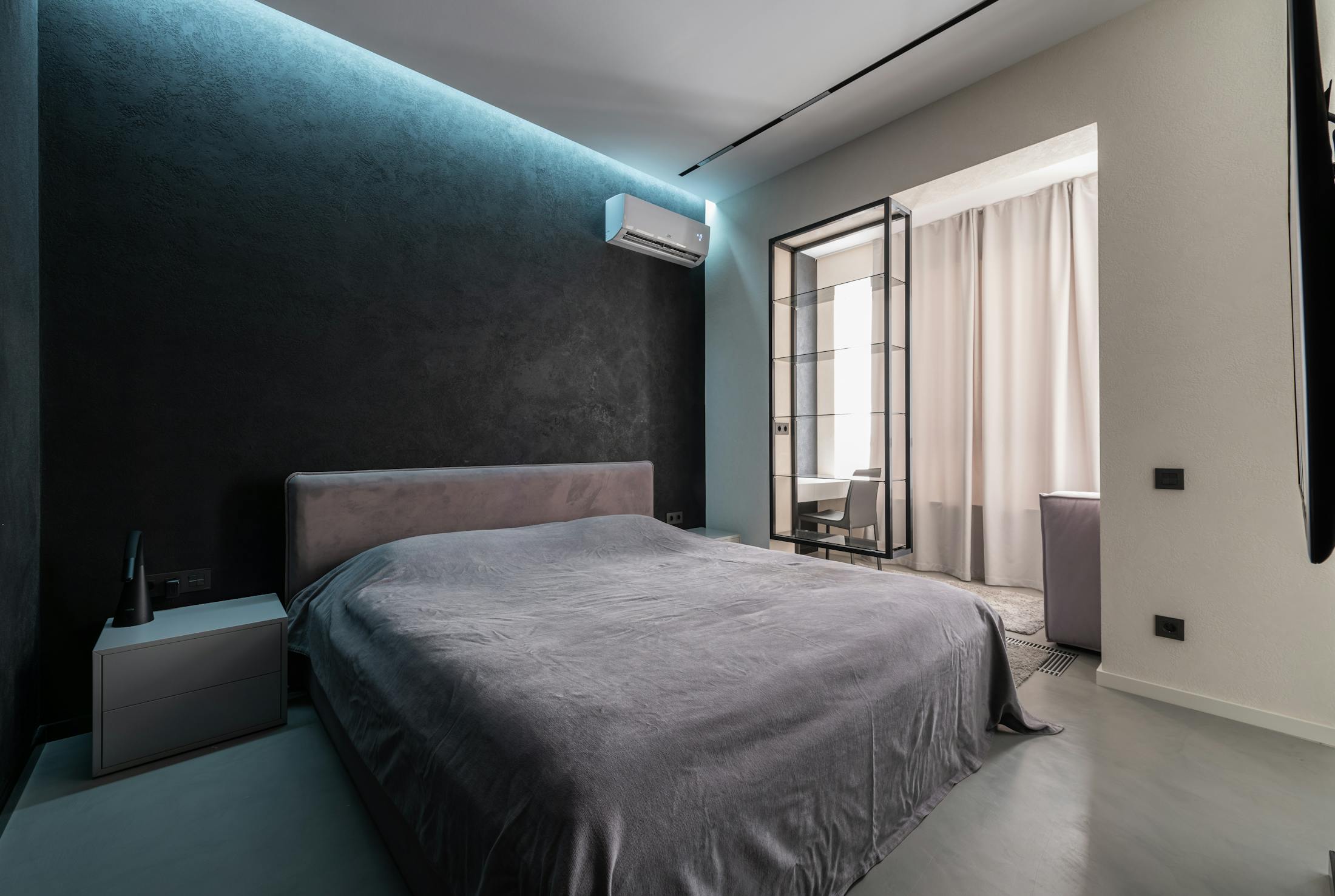 Luxury bedroom with wall mounted air conditioning